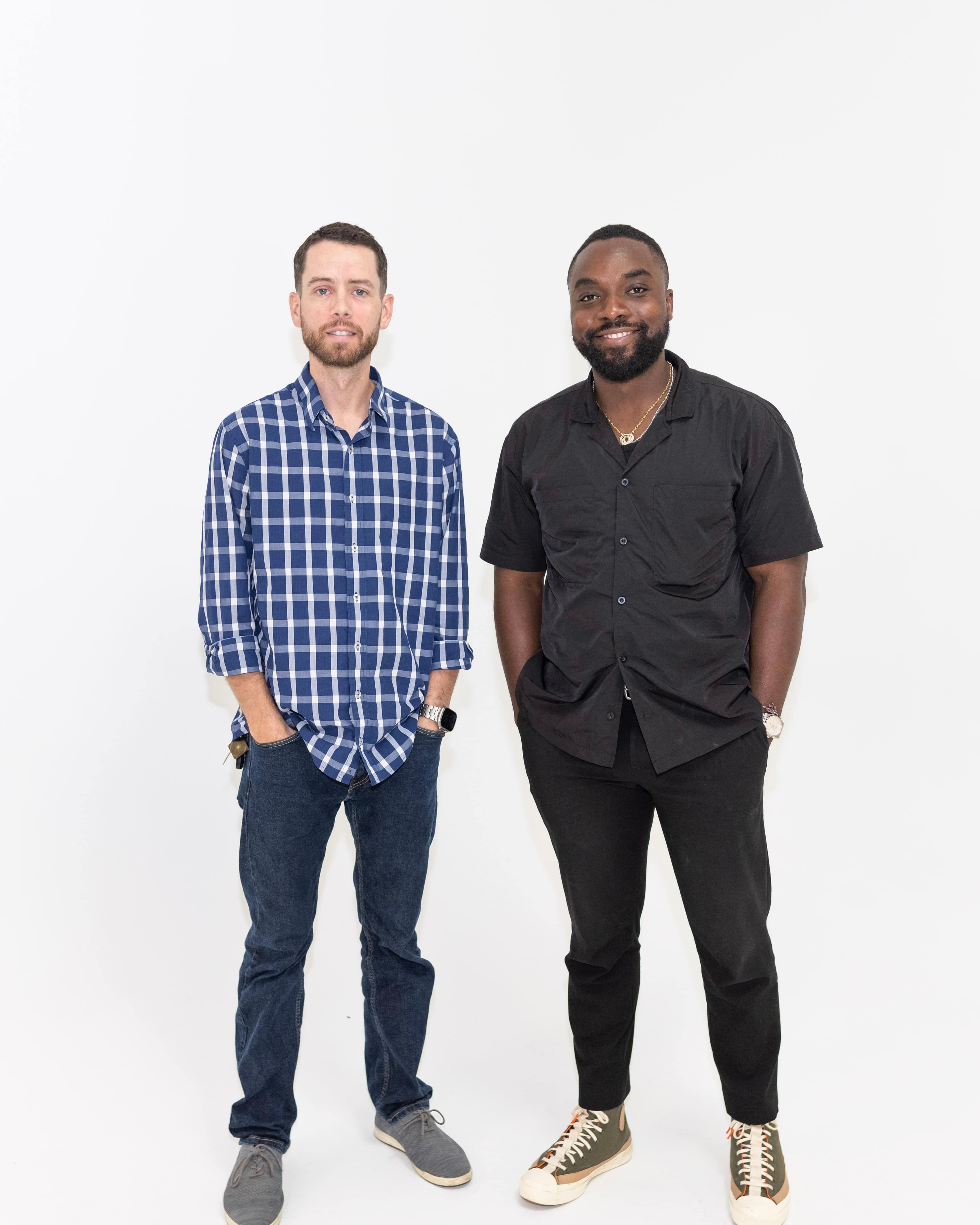 Papa and Will standing side by side against a white studio backdrop.
